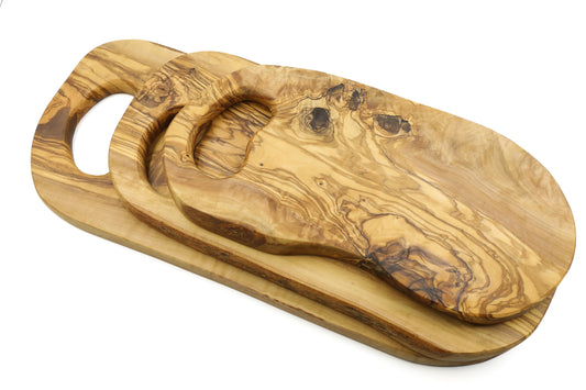 Olive wood cutting board with in-hand handle, organic shape